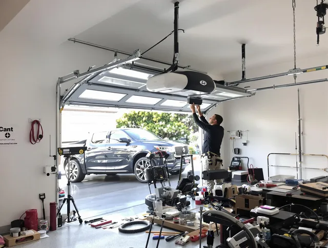 Pomona Garage Door Repair specialist installing smart garage door opener system in Pomona home